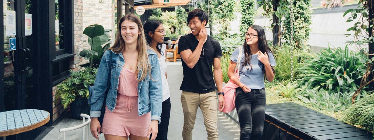 Group of young people walking together