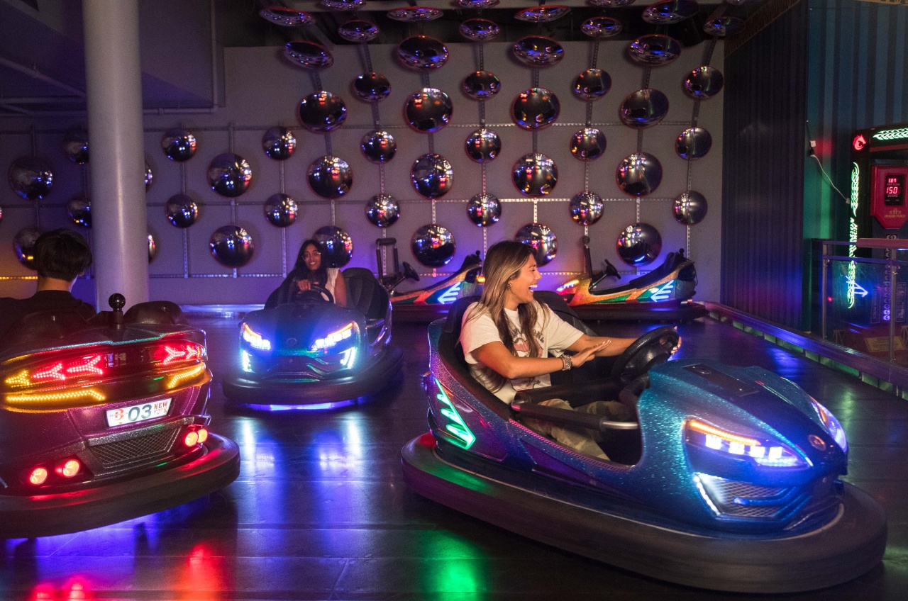 Girls having fun on bumper cars at Archie Brothers