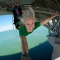 A woman bungy jumping from Auckland Harbour Bridge
