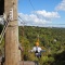 two people riding a EcoZip zipliner a tourism adventure in Auckland