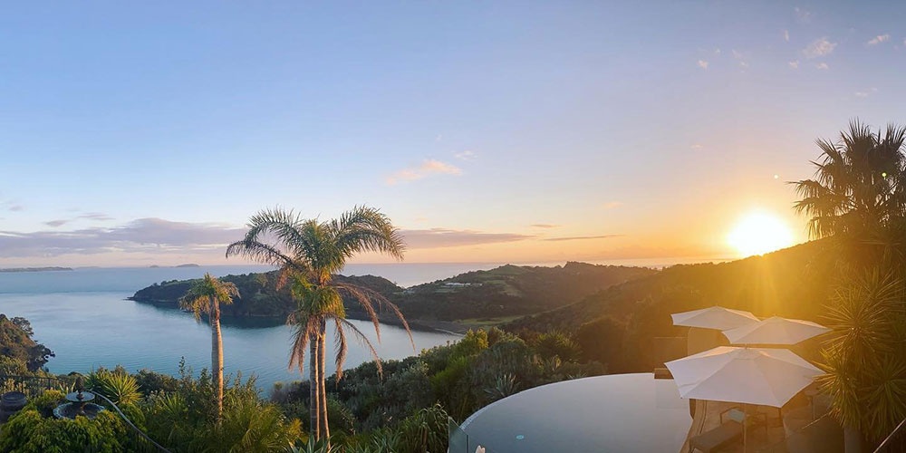 View from the top of Delamore Lodge over the infinity pool and ocean and island views