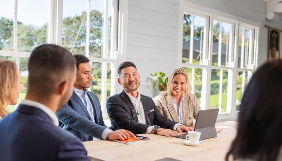 smiley-delegates-in-meeting