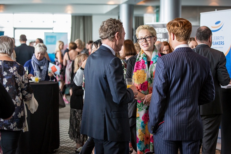 Group of three networking at an event
