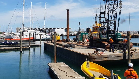 A group of construction workers on a barge - AC36 development
